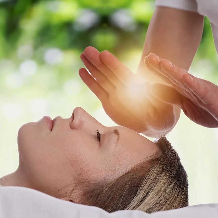 Hands glowing with Reiki energy